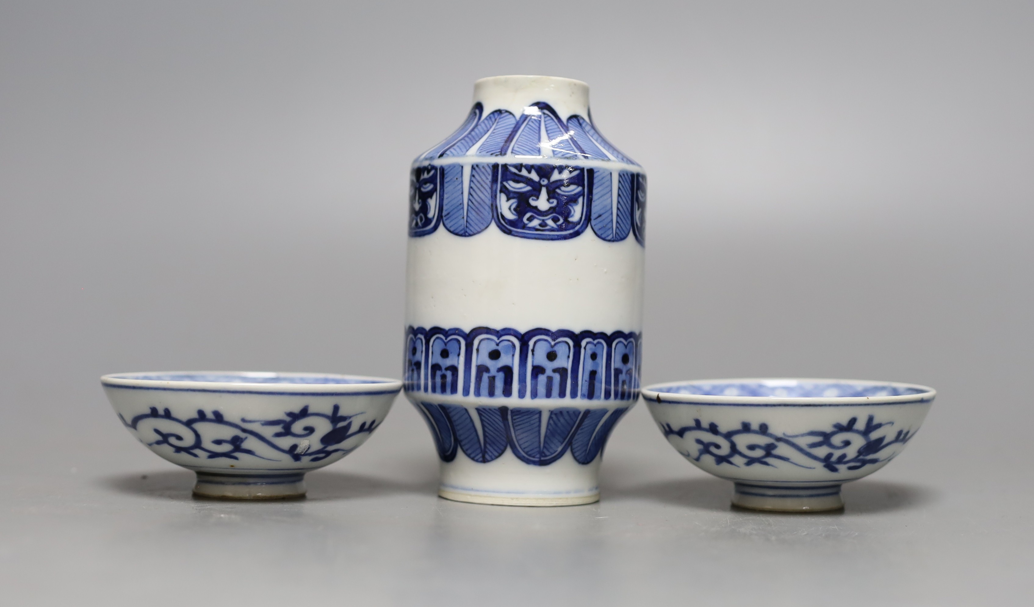 A Japanese blue and white vase, two similar dishes and a tea bowl and saucer